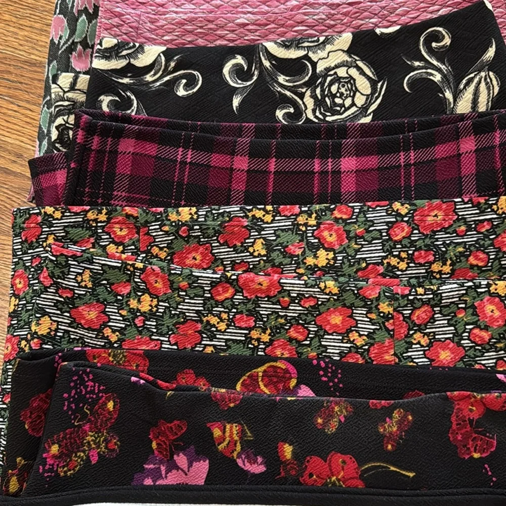 Group of 9 XS and Small LulaRoe skirts in various colors and patterns